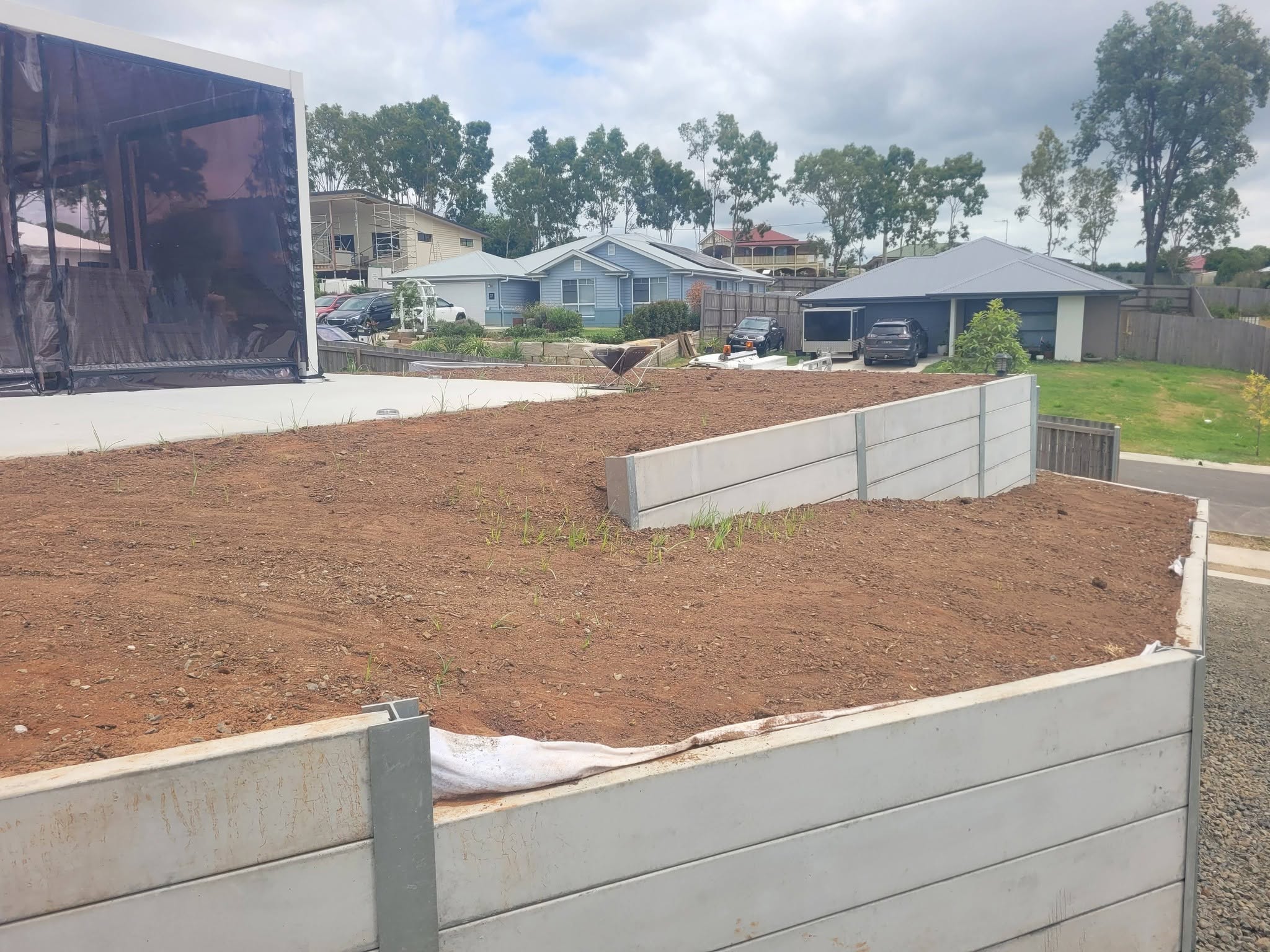 Concrete retaining wall during landscape construction